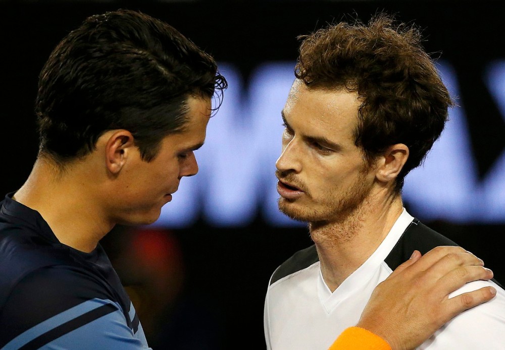 Canada's Raonic puts his hand on Britain's Murray's shoulder after losing their semi-final match at the Australian Open tennis tournament at Melbourne Park